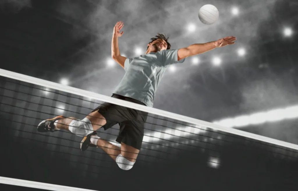 A volleyball player doing an amazing vertical jump