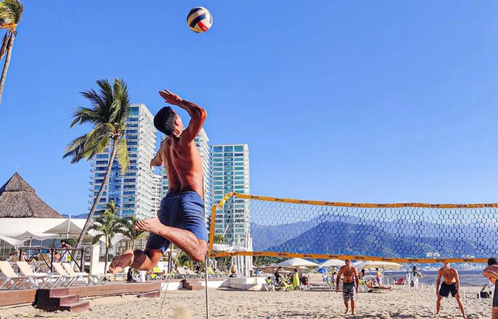 A volleyball player spiking in beach volleyball
