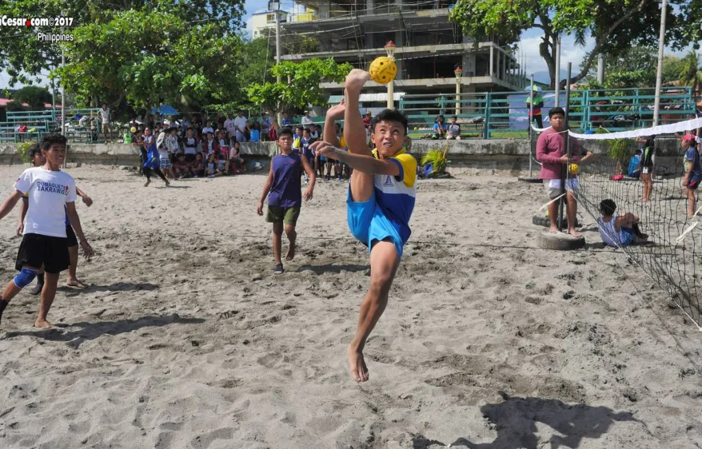 A player using his feet in kick volleyball match