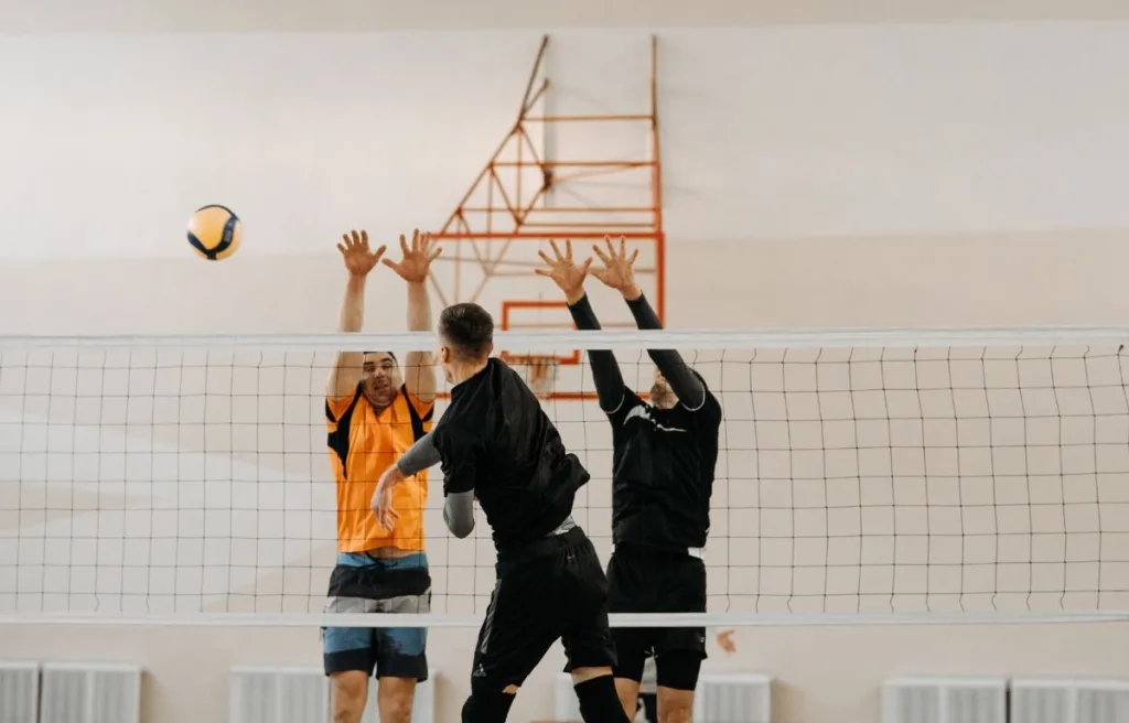 A volleyball spiking the ball harder by using his wrist
