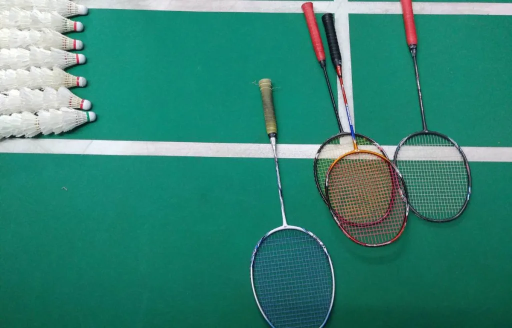 Badminton rackets lying on the court