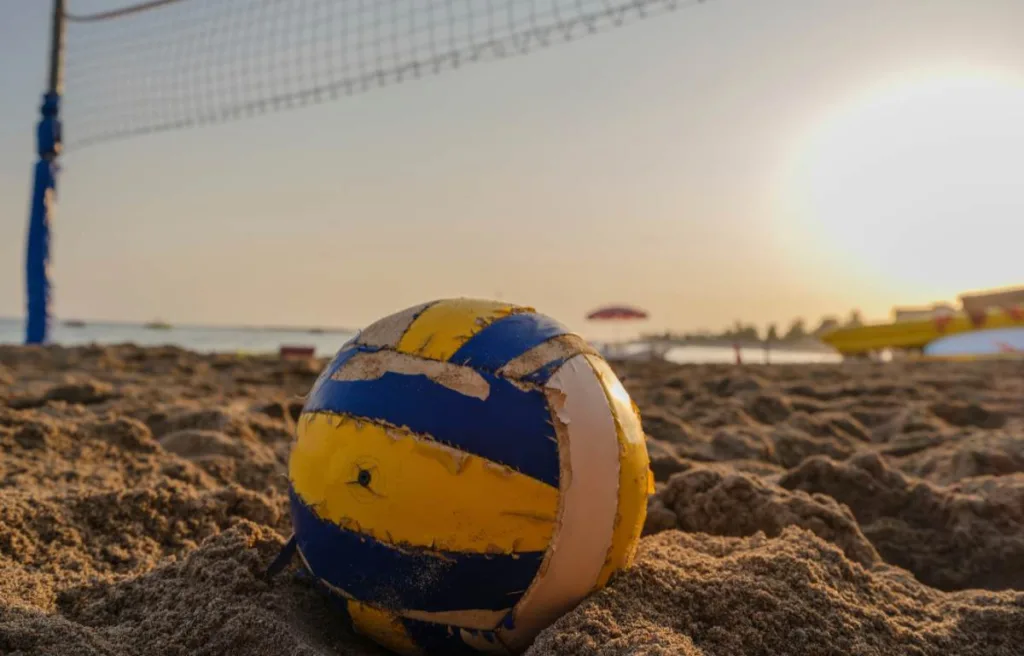 a scene of ball lying on the sand
