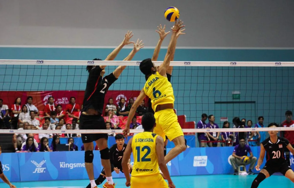 a hitter in action after the ball being set by the setter