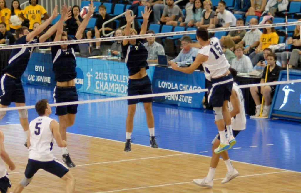 an enthusiast volleyball player trying to block a spike